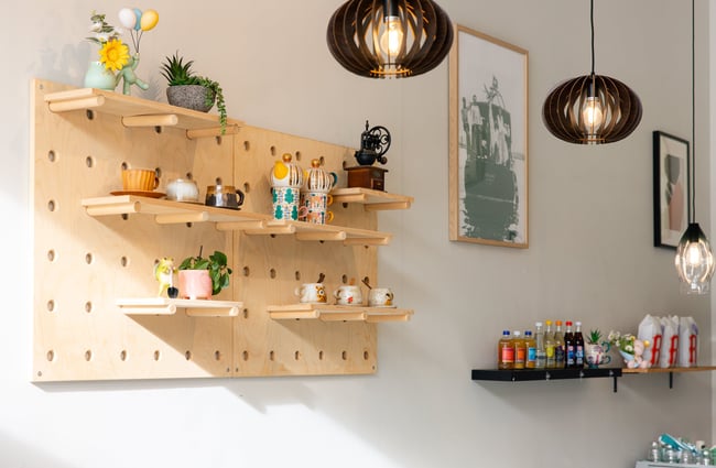 Trinkets and bottles on a wall.