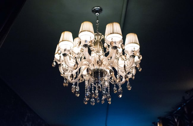 Chandelier against dark wall.
