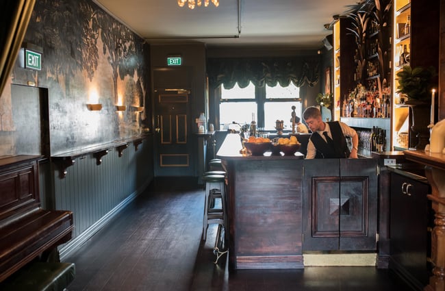 Interior of bar with bartender.