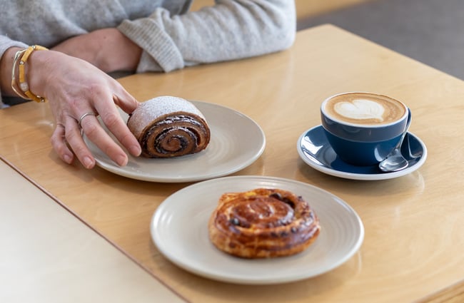 Pastries and coffee on the table at Poca Poca.