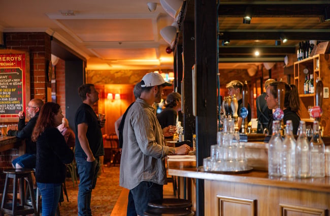 Side view of the bar where people are queueing up to order.