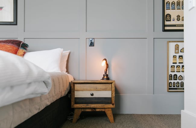 Close up of side table in the bedroom at Poshtel accommodation in Ōamaru.