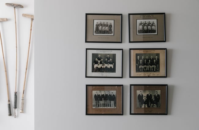 Close up of pictures hanging on the wall at Poshtel accommodation in Ōamaru.