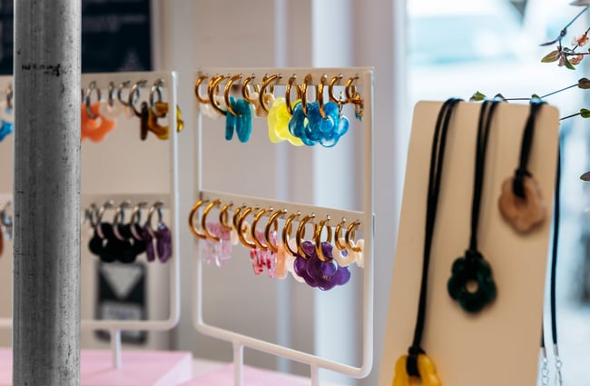 Earrings on a display rack at Preloved Charlies.