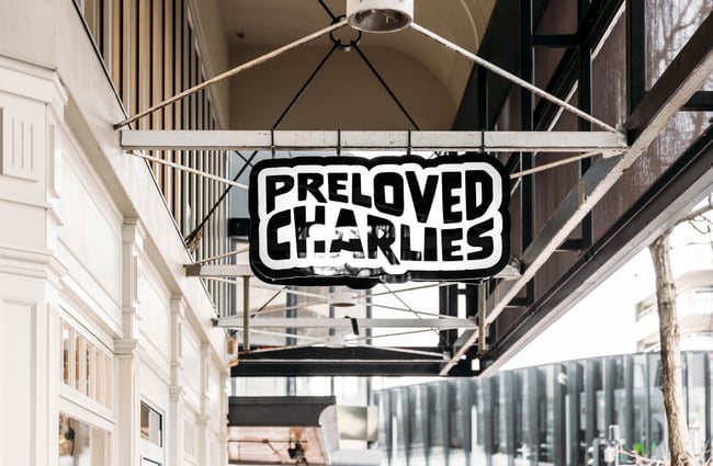 Preloved Charlies sign hanging outside the building.