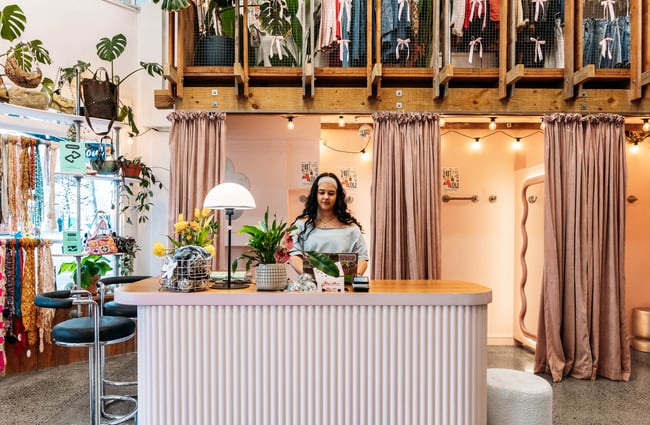 Front counter with changing rooms in the background at Preloved Charlies.