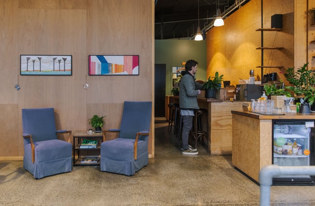 Couch seating area and bar seating area at Prima Roastery.