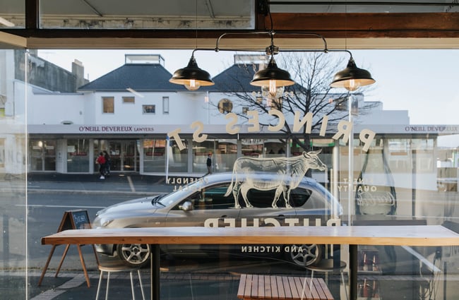 A high table at the window inside the butchery.