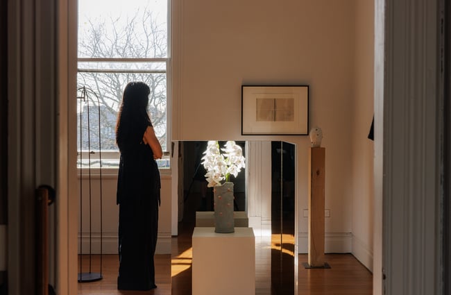 A woman looking at art.