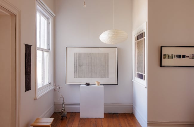 Works of art on a white wall.