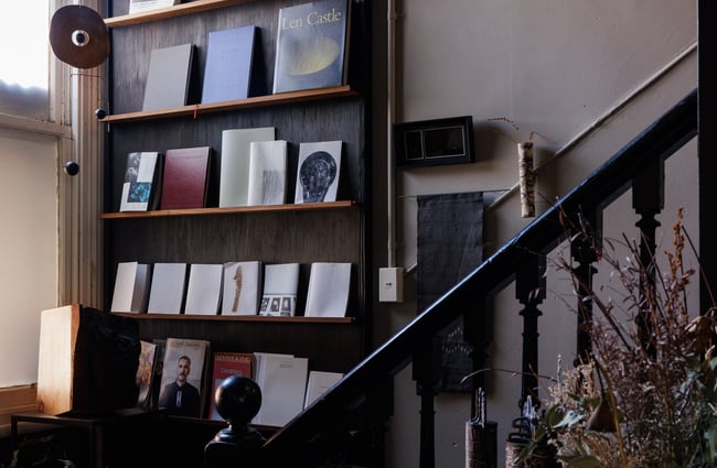 Books on display on a wooden bookshelf.