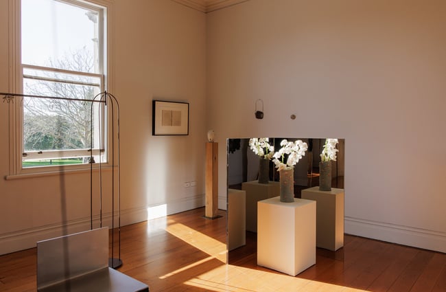 An exhibition inside a sun lit gallery.