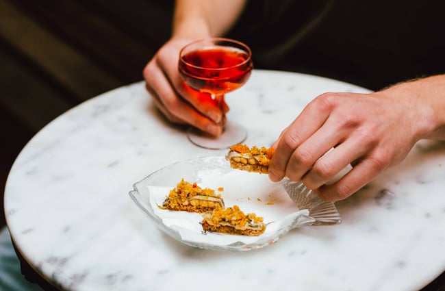 Glass of wine and canapes.