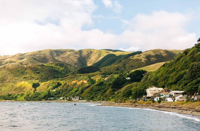 Green hillsides along the bay.