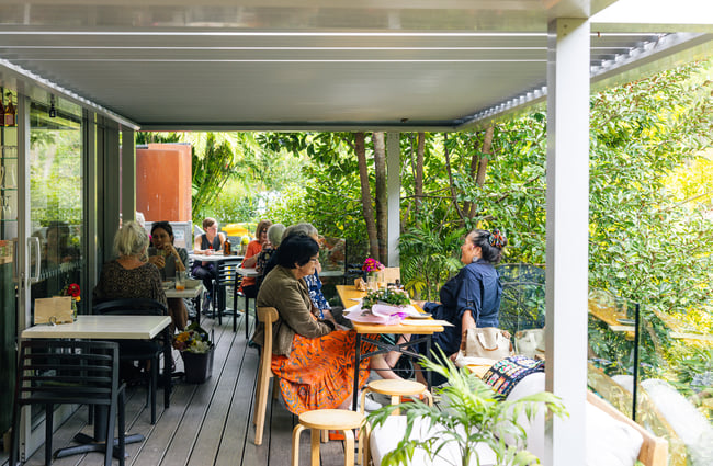 Diners sitting on the outdoor patio at Quail Cafe.