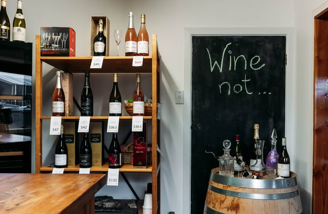Blackboard and bottles of wine on display at Quartz Reef.