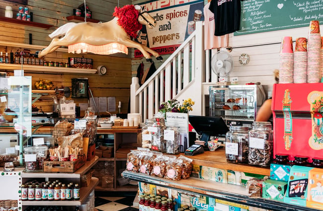 Cafe shop area full of vintage decor and packaged treats to take home