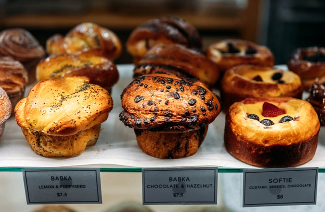 Muffins and pastries on display in the cabinet at Rudi's.