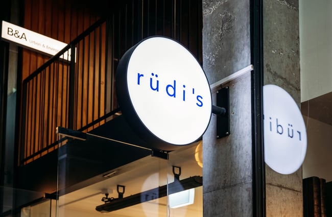 Rudi's signage outside their shop.