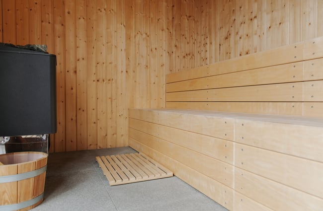 Inside a wooden seder cladded sauna at the Rabbit Island Huts.