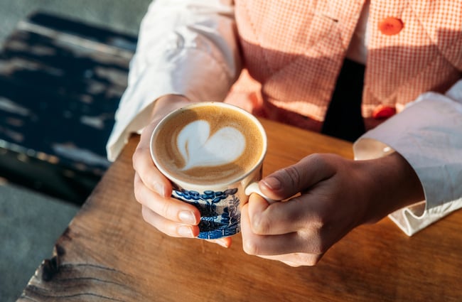 A close up of a flat white in a mug.