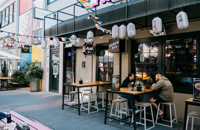 People dining outside down laneway at Ramen Ria in Christchurch