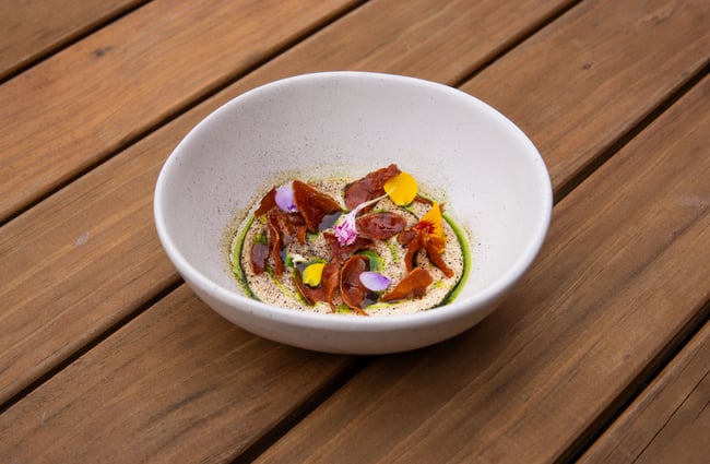 A close up of plate of food on an outdoor table.