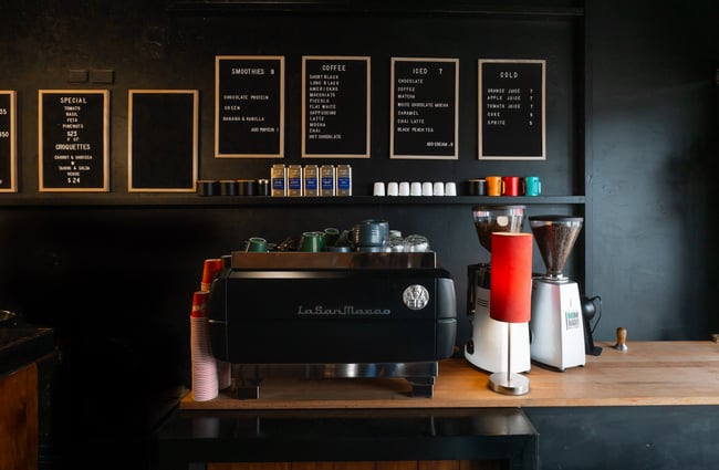 A coffee machine on a wooden counter.