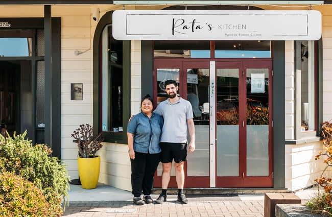 Owners Rata & Thomas standing outside Rata's Kitchen restaurant in Petone