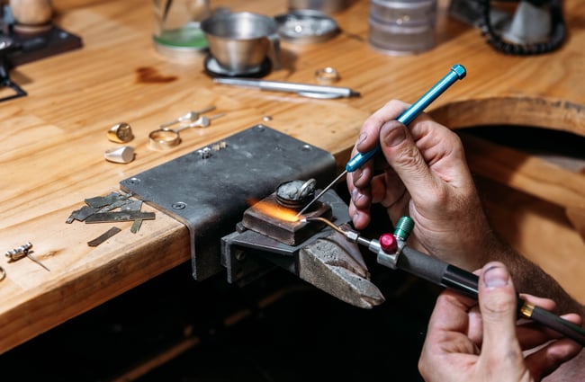 Jeweller at work at Rawson Brothers.