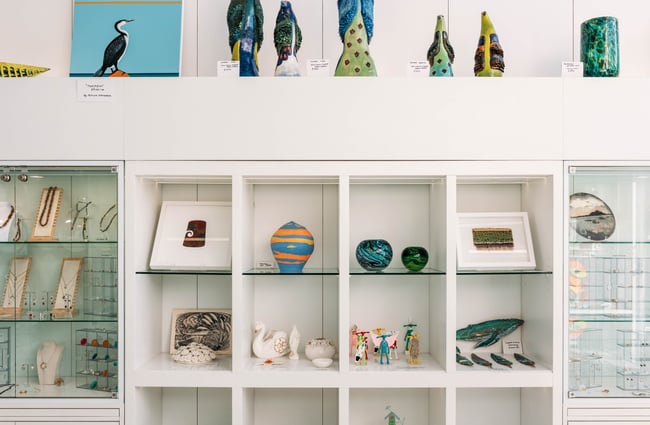 Coloured glass vases on display.