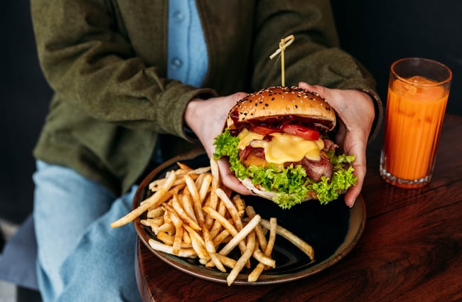 Plate of burger and fries at Recharge Bar & Cafe.