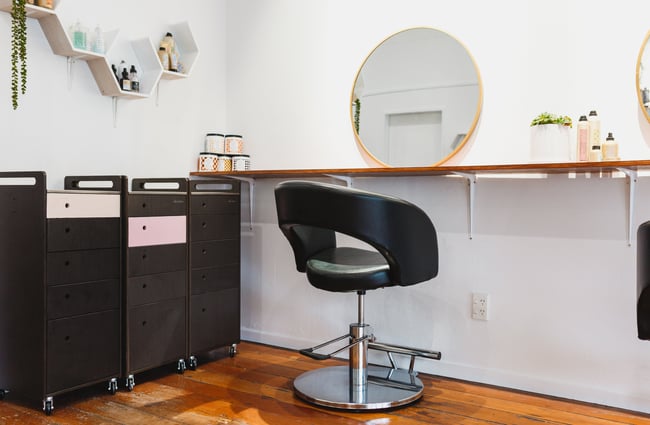 Chair in front of a mirror at Refuge Hair Boutique, Wellington.