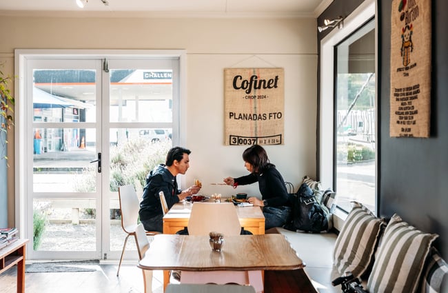 Two people dining inside Relish cafe in Rangitikei.