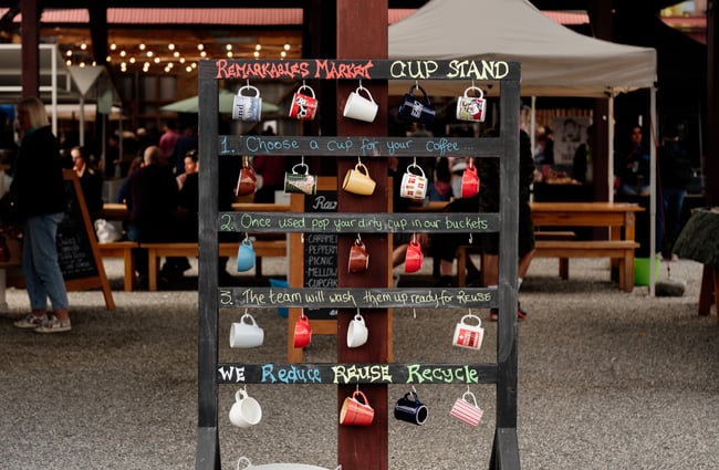 Reusable ceramic cups on display.