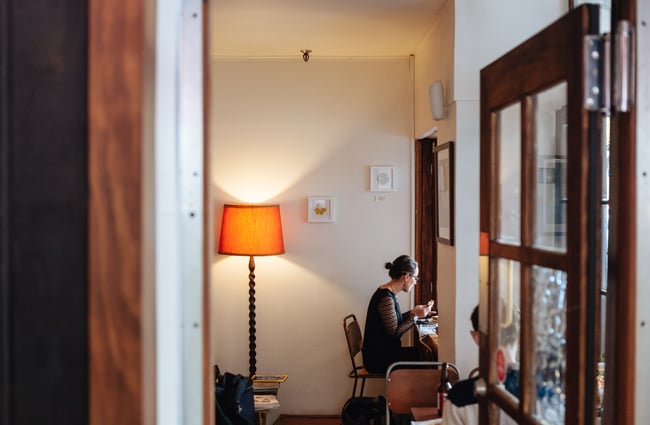 A woman eating in the cafe.