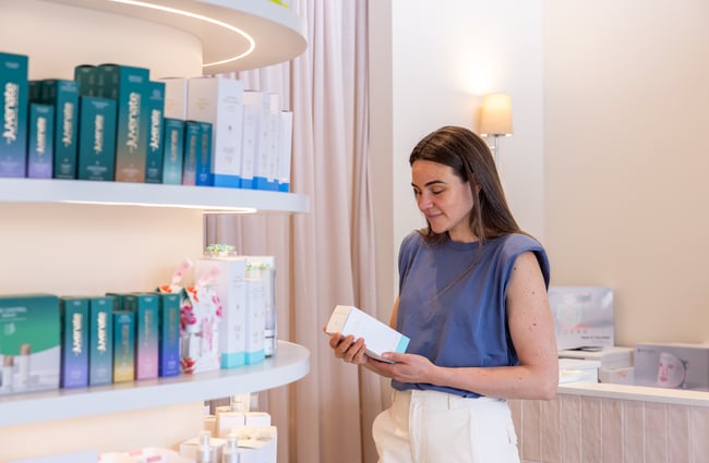 Client picking up products off shelf at Renaissance.