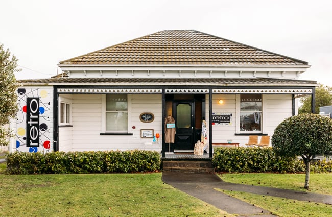 The exterior of a small house that is home to Retro Gisborne.
