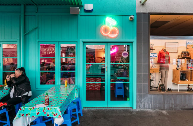 The blue painted entrance to Rice Rice Baby in Hamilton.