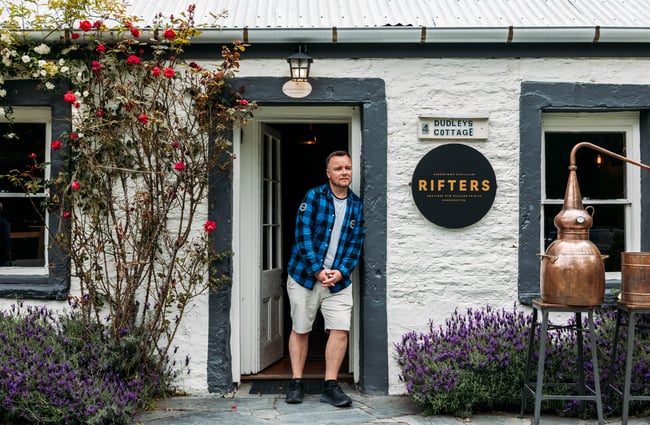 One of the owners in the doorway at Rifters Tasting Room.