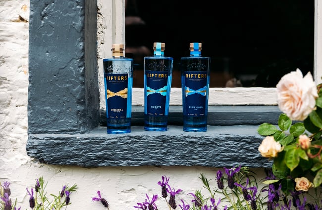 Lineup of gins on a window sill at Rifters Tasting Room.