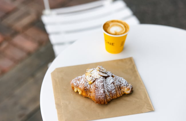 Coffee and croissant on the table at Ringawera Baker.
