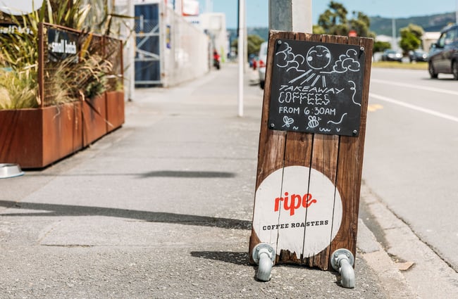 Cafe sign outside on road