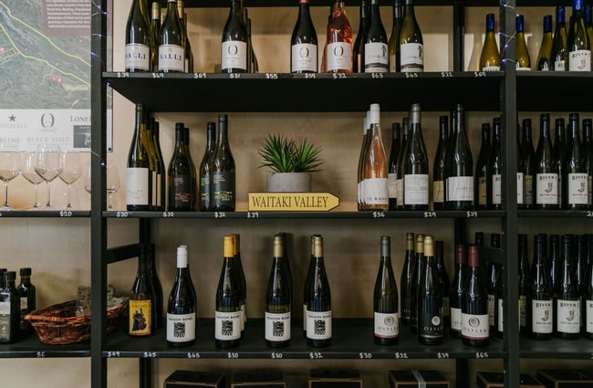 Close up of bottles of wine on shelves River-T Estate in Kurow.