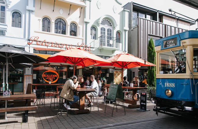 Customers eating ice cream on outside tables.