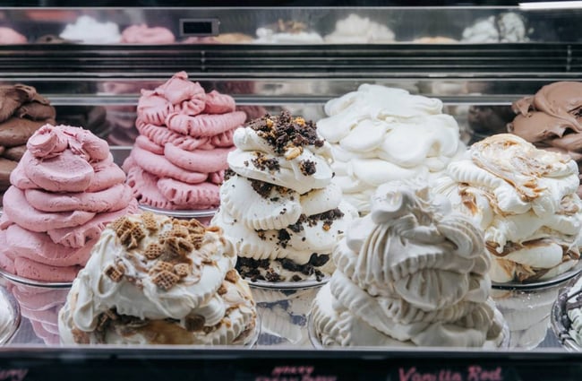 Tubs of whipped ice cream on display at Rollickin Gelato.