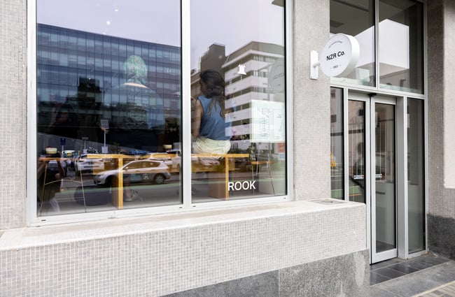 Building exterior of Rook with customers through the window.