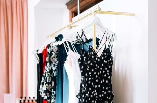 Dresses on hangers at RUBY, Wellington.