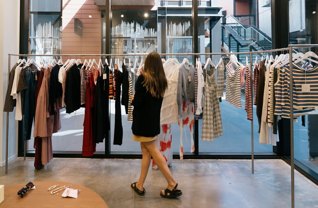 A woman browsing the racks at Ruby clothing store in Central Christchurch.