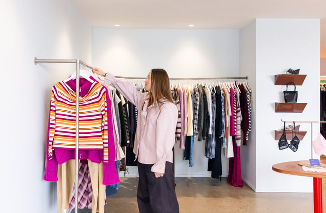 A women browsing the racks at RUBY Ponsonby Auckland.